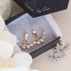 These gorgeous ear jacket earrings come paved with tiny cubic zirconia crystals and a small CZ stud to keep the earring in place. Truly a unique item that will compliment any outfit. Color: Gold & Silver Closure: Post back Ear Jacket Material: Cubic zirconia & 14k Gold plated or Silver plated on brass , topped off with clear coating for an extra layer of durability. Cubic Zirconia Ear Climbers For Party, Party Cubic Zirconia Ear Climbers, Jacket Earrings, Ear Jacket Earring, Earring Jackets, Cute Gift Boxes, Ear Jacket, Sparkly Earrings, Wedding Earrings