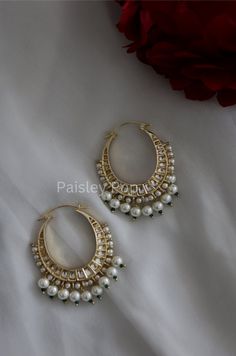 The chandbali hoops are handcrafted by the artisans of India to create a perfect romance between classic and modern concepts of Indian jewelry. The beautiful work of art made in 22K gold plating in a melange of high-grade kundan and pearls transcends the boundary of age and time that speak the language of opulence. Add this traditional Indian bridal beauty to your jewelry wardrobe and make it your companion for your special days. Earrings Length - 7 cm Closure - Lever Back Style Tip - A perfect Luxury Hand Set Chandbali Shaped Choker, Traditional Jewelry Stone, Luxury Chandbali Lehenga For Traditional Ceremonies, Luxury Chandbali Chandelier Earrings With Pearl Drop, Luxury Chandbali Necklaces For Festivals, Luxury Chandbali Jewelry For Marriage, Luxury Elegant Chandbali Bangle, Affordable White Jewelry For Puja, Luxury Elegant Chandbalis For Ceremonial Occasions