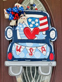 the front door is decorated with an american flag truck and heart on it's side