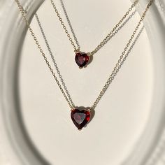 Simple, elegant, and timeless! Presenting our heart-shaped natural garnet necklace handcrafted in 9K solid gold. This style is offered in a choice of other gemstones as well. Can be paired with our Gold Heart Shape Garnet Studs. Ships within 3 business days. - Stone size: 5mm(0.5ct) or 7mm(1ct) - Stone info: natural garnet - Chain length: adjustable 16+2" - Made in 9 karat gold. - Stamp with 9K. Garnet Heart Necklace, Maroon Necklace, Contour Makeup Tutorial, Garnet Heart, Jewelry Board, Garnet Necklace, Jewelry Boards, Garnet Jewelry, Gold Heart Necklace