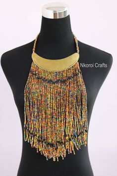 African beaded necklaces, African beaded jewelry, Beaded women jewelry, Christmas gift for her, Moms gift, Fringe necklace, Gift for her An elegant necklace that can match any outfit. Handmade by the Maasai women in Kenya using fine beads. Color: multicolor Available in different colors. 3-5 days delivery via DHL Express. Pay shipping fee for the first item only and additional items ship for free. To view more items in our shop, kindly click here: nkoroicrafts.etsy.com African Beaded Jewelry, Face Jewellery, Fringe Necklace, Jewelry Beaded, Ball Necklace, Christmas Gift For Her, African Beads, Women Christmas, Elegant Necklaces