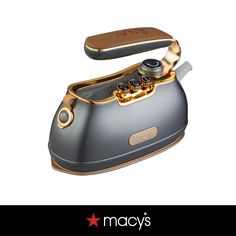 an old fashioned phone with gold trimmings on the front and back sides, is shown in this advertisement for macy's