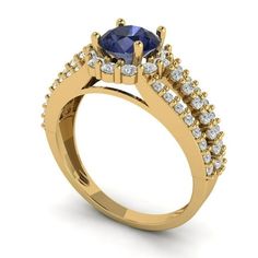 a yellow gold engagement ring with an oval blue sapphire surrounded by small diamonds