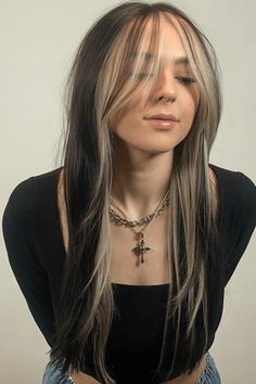 This casually stylish hairstyle shows off long hair layers with a gradual change in color that creates depth and variety. The strands framing the face are lightly highlighted using a balayage method that adds a sun-kissed warmth to the overall look, making it great for any time of year. To finish it off nicely, the hair is styled with a - Click to see more of Get Ready to Turn Heads with These 42 Adorable Hairstyles and follow us for more hairstyle ideas. // Photo Credit: Instagram @zaydisplays Blond Bangs Dark Hair, Haircuts For Updos, Cooper Peekaboo Hair, Layered Hair Cut Long Hair Women, Dyed Hair For Round Faces, Brown Hair With Caramel Peekaboos, Highlights To Frame Face, Long Black Hair Color Ideas, Shaggy Hair With Highlights