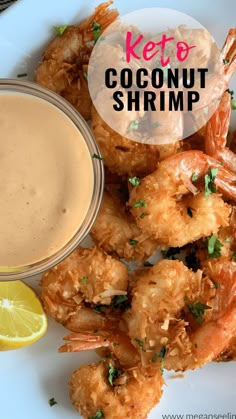 a white plate topped with shrimp and dipping sauce