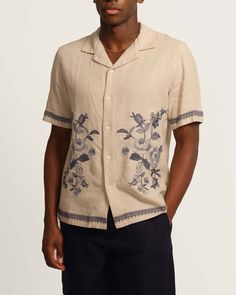 This sand blue embroidered camp shirt features a collared, short sleeve design with a beautiful mixed blues floral embroidery. The button down front adds a touch of elegance while the viscose linen blend provides comfort and durability. Perfect for casual wear, this shirt is sure to impress. Collared Short sleeve Embroidered shirt Mixed blues floral design Button down front Viscose linen blend Machine washable Size + Fit About 28.5" from shoulder to hem Model measurements: 6' tall Model is weari Embroidered Shirts Men, Mens Shirts Design Ideas, Floral Print Shirts For Men, Embroidery Tops For Women, Mens Embroidered Shirt, Embroided Shirts, Floral Menswear, Colorful Mens Fashion, Nice Outfits For Men