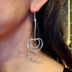 These unique, stylish and eye-catching long sterling silver earrings will always be the center of attention. These geometric silver earrings with semi circles and a bar are hammered, textured, and polished entirely by hand in our studio. The diameter of their semi circle is approximately 3 cm. and total lenght of them is approximately 7.50 cm. Every piece in our studio is hand crafted, which makes each one unique. You will have a very similar-looking earrings, but no two pieces are exactly identical. Each order comes beautifully packaged and gift wrapped. If you have any additional questions about these earrings, please feel free to contact us directly. We will get back to you within a few hours.  100% handmade! We hope you enjoy our designs as much as we enjoy creating them ❤  Want to fin Nickel-free Long Drop Sterling Silver Earrings, Modern Sterling Silver Nickel-free Linear Earrings, Modern Nickel-free Sterling Silver Linear Earrings, Modern Silver Hypoallergenic Linear Earrings, Modern Hallmarked Silver Earrings, Modern Hypoallergenic Silver Linear Earrings, Modern Sterling Silver Linear Earrings With Ear Wire, Modern Pierced Sterling Silver Earrings, Contemporary Sterling Silver Earrings For Anniversary