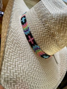 "3/4\" wide All bead work is beaded with 10lb extreme braided nylon line. All hat bands are finished at 23\" with glued than sewed down leather ends and an adjustable leather tie." Bohemian Handwoven Adjustable Hat Bands, Multicolor Beaded Hat With Curved Brim, Handmade Multicolor Hats For Rodeo, Adjustable Handwoven Hat Bands For Rodeo, Multicolor Beaded Brimmed Hat, Braided Hat Bands For Festivals With Flat Brim, Western Style Adjustable Handwoven Hat Band, Multicolor Beaded Short Brim Hat, Adjustable Braided Hat Bands For Rodeo