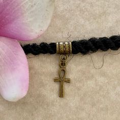 This is a antique bronze dread/braid cuff (or Euro style bracelet charm) featuring an antique bronze ankh charm.  Two cuff/bail styles available. See pic 3 Size: Opening/hole is 5mm for both cuff styles.  These are solid cuffs, they are not adjustable and they do not open. 💥See all pics for a size comparison to a US dime.  Please use the dropdown menu for your cuff style choice.  All items are lead and nickel free. Adjustable Bohemian Bracelet With Antique Finish, Bohemian Antique Gold Adjustable Bracelets, Adjustable Brass Braided Bracelets For Gifts, Handmade Adjustable Bronze Braided Bracelets, Locs Hair Jewelry, Braid Cuffs, Dread Braids, Dreadlock Jewelry, Loc Jewelry