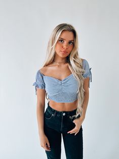 DETAILS: Our Morrilyn Crop Top is an off the shoulder crop top is loaded full of details. This top features a padded bust, smocked bodice, and off the shoulder neckline. The sleeves on this top feature elastic to give the top a more secure fit. This top has a lot of stretch throughtout if in between sizes we recommend sizing up. CONTENT & CARE: SELF: 100% Polyester SIZE & FIT: Model is 5'6" The model is wearing a size medium Fits true to size The Fabric has stretch Trendy Fitted Off-shoulder Smocked Top, Trendy Ruched Off-shoulder Top For Spring, Trendy Off-shoulder Smocked Top For Summer, Trendy Fitted Tube Top With Smocked Bodice, Trendy Off-shoulder Smocked Summer Top, Spring Off-shoulder Tube Top With Smocked Bodice, Off-shoulder Smocked Bodice Tube Top For Spring, Spring Off-shoulder Smocked Bodice Tube Top, Summer Off-shoulder Crop Top With Smocked Bodice