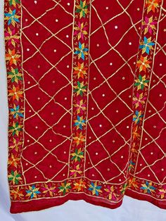 All over gotta patti phulkari work chinon silk dupatta is a perfect piece for Punjabi India Pakistani weddings, sangeet, jaago, mehndi or any festive occasion. Phulkari dupatta can be easily paired with almost any color for a beautiful contrasted look or Pair it with your jaago night dance party outfit. It is also unique gift for women on her birthday, mother’s day, or anniversary. Hand Embroidered Product Material: Chinon Silk Work: Silk Thread Phulkari, Needlework, Gotta Patti Work Pattern: Fl Festival Anarkali Dupatta With Cutdana, Festival Cutdana Anarkali Dupatta, Red Saree With Dupatta For Festival, Multicolor Embroidered Kundan Dupatta For Eid, Multicolor Embroidered Dupatta For Eid, Red Traditional Wear With Dupatta For Festival, Unstitched Traditional Wear With Zari Work For Festival, Traditional Wear With Multicolor Embroidery And Dupatta For Celebration, Traditional Kundan Dupatta With Multicolor Embroidery