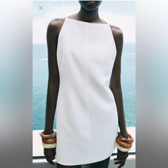 Short Halter Dress. Pronounced Tonal Topstitching Detail. Back Hidden In-Seam Zip Closure. Lined. Oyster-White | 7954/315 Zara Clothes Women, Short Halter Dress, Brand Portfolio, 2024 Clothes, Classic Elegant Style, Zara Summer, Zara Mini Dress, Halter Dress Short, Oyster White