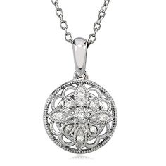 This vintage-inspired sterling silver design has an old fashioned elegance that never goes out of style. The 15mm circle blossom features an open motif infused with nine white diamonds and finished with milgrain detailing. It includes a sterling silver cable chain finished with a spring ring clasp. Each round cut diamond is I2 in clarity and G-H in color. Total diamond weight is .05 of a carat. Diamond Flower Necklace, Bow Jewelry, Silver Design, Diamond Flower, Jewelry Companies, Black Bow, White Diamonds, Flower Necklace, Round Cut Diamond