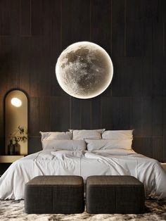 a large bed sitting in a bedroom under a giant moon