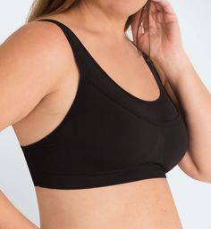 This medium impact sports bra features wide, padded straps that easily convert to a crossback and a seamless stretch fabric underband for comfortable support. Made from nylon and spandex. Wireless, seamless cups are unlined (unpadded). Front has double-layer seamless stretch fabric for better support and opacity. Key pocket at top left front. Breathable mesh front has a knit-in center triangle to separate breasts. Knit panels create encapsulation for a better fit. Full coverage neckline edges ha Supportive Full Coverage Sports Bra With Built-in Bra, Micro-elastic Gym Bra With Built-in Support, Compressive Full Coverage Sports Bra With Built-in Bra, Contoured Sports Bra With Built-in Bra For Yoga, Black Stretch Bra With Built-in Padding, Solid Nylon Sports Bra With Built-in Bra, Black Full Coverage Sports Bra With Built-in Bra, Black Mesh Sports Bra With Built-in Bra, Supportive Full Coverage Sports Bra With Built-in Padding