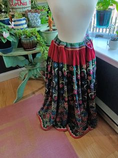 Beautiful, hand-embroidered, hand-made, one-of-a-kind, vintage Indian Banjara skirt.  Dating back to 1960s or 1970s, it's likely that the actual cotton fabric in this skirt was hand-woven and hand-dyed...in addition to all of the hand-stitching of the embroidery.  Tiny mirrors are stitched into the embroidery throughout.  Skirt is heavy and can fit a variety of sizes due to the drawstring waist.  On the dress form, the drawstring is pulled to fit a size medium.  However, it can be let out to fit an XXL.  Colors are vibrant with only a tiny bit of fading on the upper portion of the waist on the inside of the skirt.  Otherwise, in great condition with no rips, tears, marks, etc.  Skirt is floor length. See photos for details and measurements. Please message with any questions. Festive Bohemian Cotton Skirt, Traditional Cotton Skirt For Festival, Bohemian Multicolor Embroidered Skirt, Bohemian Multicolor Skirt With Floral Embroidery, Multicolor Bohemian Skirt With Floral Embroidery, Festive Bohemian Embroidered Skirt, Traditional Green Embroidered Skirt, Bohemian Embroidered Festival Skirt, Bohemian Embroidered Skirt For Festivals