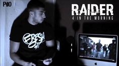 a man sitting in front of a computer monitor with the words raider on it