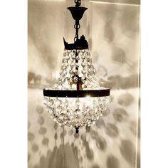 a chandelier hanging from the ceiling in a room