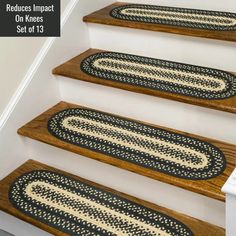 the stair treads are made from wood and braided with jute rugs