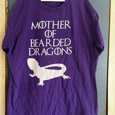 Size Medium “Mother Of Bearded Dragons” Purple T Shirt. Never Worn. Smoke Free/Pet Friendly Home Dragons Purple, Dragon Game Of Thrones, Game Of Thrones Shirts, Dragon Games, Purple T Shirts, Bearded Dragon, Shirt Color, Pet Friendly, Game Of Thrones