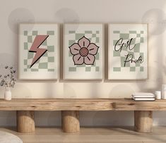 three art prints on the wall above a wooden bench