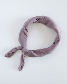 A life essential for you to take anywhere, each scarf is made from 100% washable-silk, has a hand-rolled and hand-sewn edge. Meant to be lived-in, worn, and washed, our hand-dyed heirloom scarves have a bit of magic in their making. The Scout Washable Silk Scarf is our medium size scarf: approximately 23 inches x 23 inches. The silk is soft in hand and light in weight, an uber elegant bandana. With endless ways to wear it—on your shoulders, around your neck, or over your hair on a summer day—you Chic Solid Color Silk Scarf, Chic Solid Scarves For Spring, Chic One Size Silk Scarf, Chic Silk Scarf, Scout Scarf, Chic Scarves, The Scout, Mauve Color, Silk Pillowcase