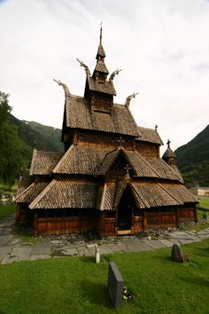 an old wooden church with thatched roof