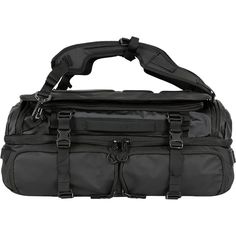 an empty black duffel bag with straps on the handle and shoulder strap, sitting in front of a white background