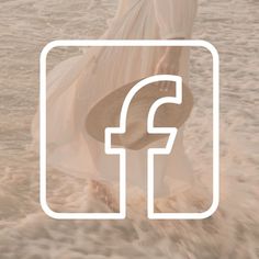 a person walking in the water with a surfboard under their arm and an f logo above them