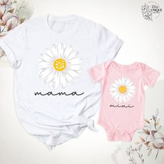 Daisy Mama Mini T-Shirt, Mama And Me Groovy Daisy Flower Shirt, Mom Baby Matching Birthday Party Shirts, Mama And Mini Tees, Mothers Day Tee. Hello, Welcome to Blue Unique Boutique, your destination for unique and handcrafted shirts! I'm Eve! I have been thinking about creating my business for a long time and now I have taken the first step towards it and it gives me excitement. As a small business, I take pride in creating unique designs from the comfort of our homes. Each shirt is carefully cr Family Matching White T-shirt With Cartoon Print, White Cartoon Print T-shirt For Spring, White T-shirt For Summer Gift, Pink Birthday Shirt For Summer, Pink Summer Birthday Shirt, White T-shirt With Cartoon Print For Spring, Family Matching Cartoon Print T-shirt For Summer, Pink Family Matching Shirt For Summer, Cute Cartoon Print T-shirt For Mother's Day