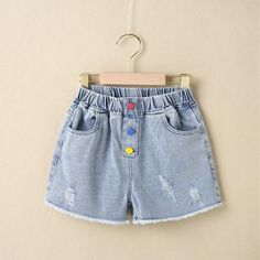 *Product Title:Kid Girl Color Button Casual Denim Shorts*Keyword Tag:wholesale baby clothes manufacturers*Fabric:Denim*Thickness:Regular*For Season:Summer*Care Label:On the inside Cute Denim Blue Cotton Shorts, Playful Denim Blue Jeans For Summer, Cute Cotton Jeans For Summer, Cute Summer Cotton Jeans, Playful Blue Jean Shorts For Spring, Playful Denim Blue Bottoms, Playful Denim Shorts, Cute Jean Shorts With Pockets, Playful Summer Jeans With Pockets