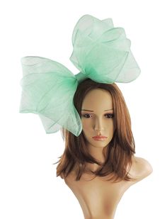 Gorgeous sinamay Mint Greenbow fascinator Base measures about 12-14 inches wide This Fascinator is mounted on a headband Unsure about colour? We send can send free colour samples anywhere in the world. Simply email us with colours and address. Samples can take a week to 10 days so be sure to ask early. We do combine shipping even with our expedited service so if you have a friend who needs something it is only a couple of dollars more to include a second item. Adjustable Bow Fascinator For Party, Adjustable Party Fascinator With Bow, Party Hat With Bow And Curved Brim, Spring Party Hair Accessories With Decorative Bow, Elegant Spring Hair Accessories With Decorative Bow, Spring Church Fascinator, Chic Hair Accessories For Spring Party, Chic Summer Evening Hair Accessories, Chic Spring Formal Hair Accessories