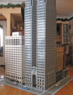 a model of two tall buildings on a wooden floor