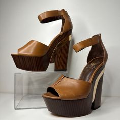 Brand New Vince Camuto Bailor Wedge In Fudge Brown. Shoe Box Not Included. Gleaming Metal Lends Sculptural Intrigue To An Ankle-Strap Wedge In Triple Neutral Hues. Back Zip Closure. Approx. Heel Height: 5" With A 2" Platform (Comparable To A 3" Heel). Leather Upper/Synthetic Lining And Sole. By Vince Camuto; Imported. Women's Shoes. Modern Brown Platform Wedge Sandals, Modern Brown Wedge Sandals, Brown Platform Wedge Heels, Brown Platform Heels With Wedge Heel, Formal Brown Wedge Sandals With 4-inch Heel, Formal Brown Platform Wedge Sandals, Shoe Goals, Platform Wedges Shoes, Beautiful Heels