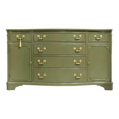 a green dresser with gold handles and drawers