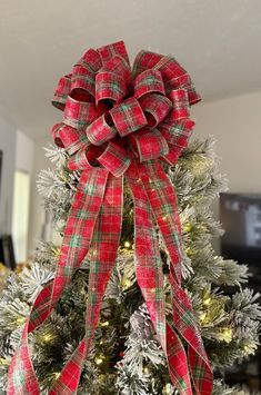 a christmas tree with a red and green bow