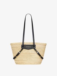 Small Voyou basket bag in raffia Designer Woven Leather Bucket Straw Bag, Designer Woven Leather Straw Bucket Bag, Designer Straw Bag With Handles, Designer Straw Tote Bag With Bamboo Handle, Luxury Straw Bucket Bag With Woven Leather, Luxury Woven Leather Straw Bucket Bag, Luxury Leather Basket Bucket Bag, Designer Natural Straw Bag With Handles, Designer Straw Bag With Leather Handles For Shopping