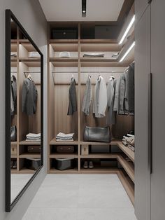 a walk - in closet with clothes and shoes on the shelves next to each other