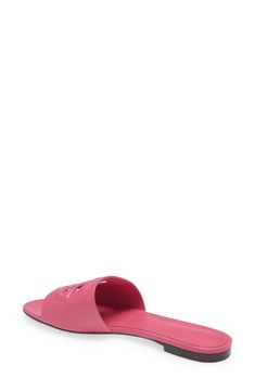 This versatile slide sandal is topped with a dimensional DG logo for added volume. Leather upper, lining and sole Imported Women's Designer Shoes Designer Synthetic Slides Slip-on, Designer Synthetic Slip-on Slides, Luxury Synthetic Slip-on Slides, Designer Beach Slides With Branded Insole, Designer Slides With Branded Insole For Beach, Pink Flat Slides With Rubber Sole, Designer Synthetic Sandals For Beach, Beach Slides With Rubber Sole And Open Heel, Beach Slides With Open Heel And Rubber Sole