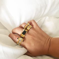 Metal movement. The One Finger Two Finger Ring features three geometric pieces with a precious stone fastening them together form one elegant ring or two with a simple flip of the finger. Pair with the Big Block Ring for a bold gemstone statement or the Hinge Ring for an industrial touch. Tap now to shop! #Minimalistic #Simple #Chic #Elegant #Luxury #Modern #nyc #Fashion #Classy #Trendy #Jewelry #angle #rings #collections #new #style #accessories #silver #gold  #gift #design #gemstone