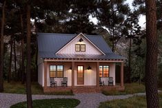 the small house is surrounded by trees and grass