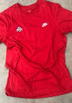 Nike Ohio State Buckeyes Red Futura Emb Short Sleeve T Shirt - 12553148 Ohio State Merch, Sporty T-shirt With Embroidered Logo For Sports, Red Sporty Crew Neck T-shirt, Sports Cotton Tops With Embroidered Logo, Nike Crew Neck Top With Embroidered Logo, Nike Sporty Tops With Embroidered Logo, Nike Varsity Top For Fan Gear, Casual Tops With Embroidered Logo For Fan Gear, Cotton Tops With Embroidered Logo For Fan Gear