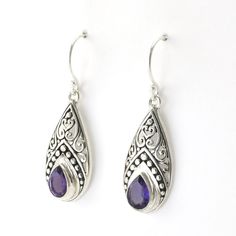 Handmade sterling silver amethyst tear shaped dangle earrings are 1 7/16 inches long and 7/16 inch wide. Earrings come with a pair of clear rubber earring stoppers for the ear wires. Style Number: 15645 Metal: 925 Sterling Silver Gemstone: Genuine Amethyst Dimensions: 1 7/16 inches long and 7/16 inch wide Handmade in Bali, Indonesia Classic Teardrop Purple Earrings, Purple Sterling Silver Teardrop Earrings, Purple Sterling Silver Teardrop Dangle Earrings, Purple Sterling Silver Long Drop Earrings, Long Drop Purple Sterling Silver Earrings, Sterling Silver Gemstone Teardrop Pendant Earrings, Nickel Free Teardrop Purple Earrings, Sterling Silver Gemstone Teardrop Earrings, Nickel Free Purple Teardrop Earrings