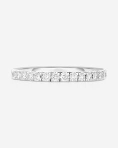 Platinum Diamond details: Color: G-H Clarity: SI Diamond coverage: half 1.3 mm: 21 round, natural diamonds Total carat weight: approximately 0.15 Band width: 1.3 mm Band thickness: 1.4 mm 1.6 mm: 18 round, natural diamonds Total carat weight: approximately 0.25 Band width: 1.6 mm Band thickness: 1.4 mm 1.9 mm: 17 round, natural diamonds Total carat weight: approximately 0.34 Band width: 1.9 mm Band thickness: 1.5 mm 2.5 mm: 15 round, natural diamonds Total carat weight: approximately 0.75 Band w Modern Diamond Half Eternity Band, Modern Half Eternity Diamond Band, Minimalist White Diamond Ring With Single Cut Diamonds, Diamond White Single Cut Lab Grown Diamond Ring, White Minimalist Diamond Ring With Single Cut Diamonds, Dazzling Half Eternity Diamond Ring With Round Band, Dazzling Diamond White Half Eternity Ring, Minimalist Diamond Eternity Band With Brilliant Cut, Minimalist Diamond Eternity Band With Vvs Clarity