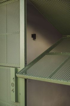 the inside of a storage room with metal mesh walls