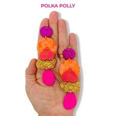 A striking pair of vibrant pink and orange  handmade leather earrings. Bold, bright use of patterns and textures, mixed with hand painted and metallic highlights. Hung from golden stainless steel hooks. Lightweight and comfortable to wear. Colour and pattern placements will differ between pairs. Please view more styles on our website-  WWW.POLKAPOLLY.COM Bold Handmade Polymer Clay Earrings, Handmade Vibrant Pink Earrings, Vibrant Handmade Pink Earrings, Vibrant Pink Handmade Earrings, Earrings Bold, Jewelry Product Shots, Rose Orange, Statement Earring, Classy Jewelry