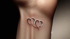 three hearts tattoo on the wrist