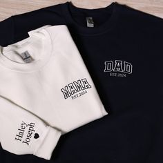 Personalized Dad Embroidered Sweatshirt, Custom Mama Hoodie With Kids Names On Sleeve, Matching Mom & Dad Outfits, Baby Announcement Gifts Looking for a distinctive personalized sweatshirt? These embroidered sweatshirts offer a wonderful option for various occasions such as anniversaries, gifts for your significant other, or as a keepsake for a special milestone in your relationship. To Place Your Order: Begin by selecting your preferred sweatshirt color. Then, choose the size that fits you best Matching Family Hoodie, White Hooded Top With Custom Embroidery, White Crew Hoodie With Embroidered Graphics, White Fleece Sweatshirt With Embroidered Text, White Fleece Top With Custom Embroidery, White Hoodie With Embroidered Graphics, White Fleece Top With Embroidered Graphics, White Embroidered Crew Hoodie, White Embroidered Graphics Hoodie