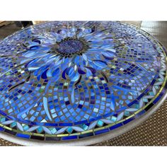 a blue and white mosaic glass table top