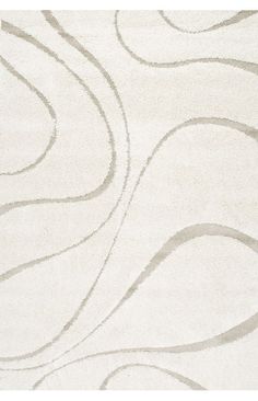 a white rug with wavy lines on it